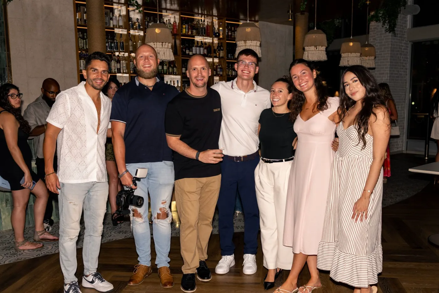 A party of seven celebrating together at the Esquina No. 525 bar