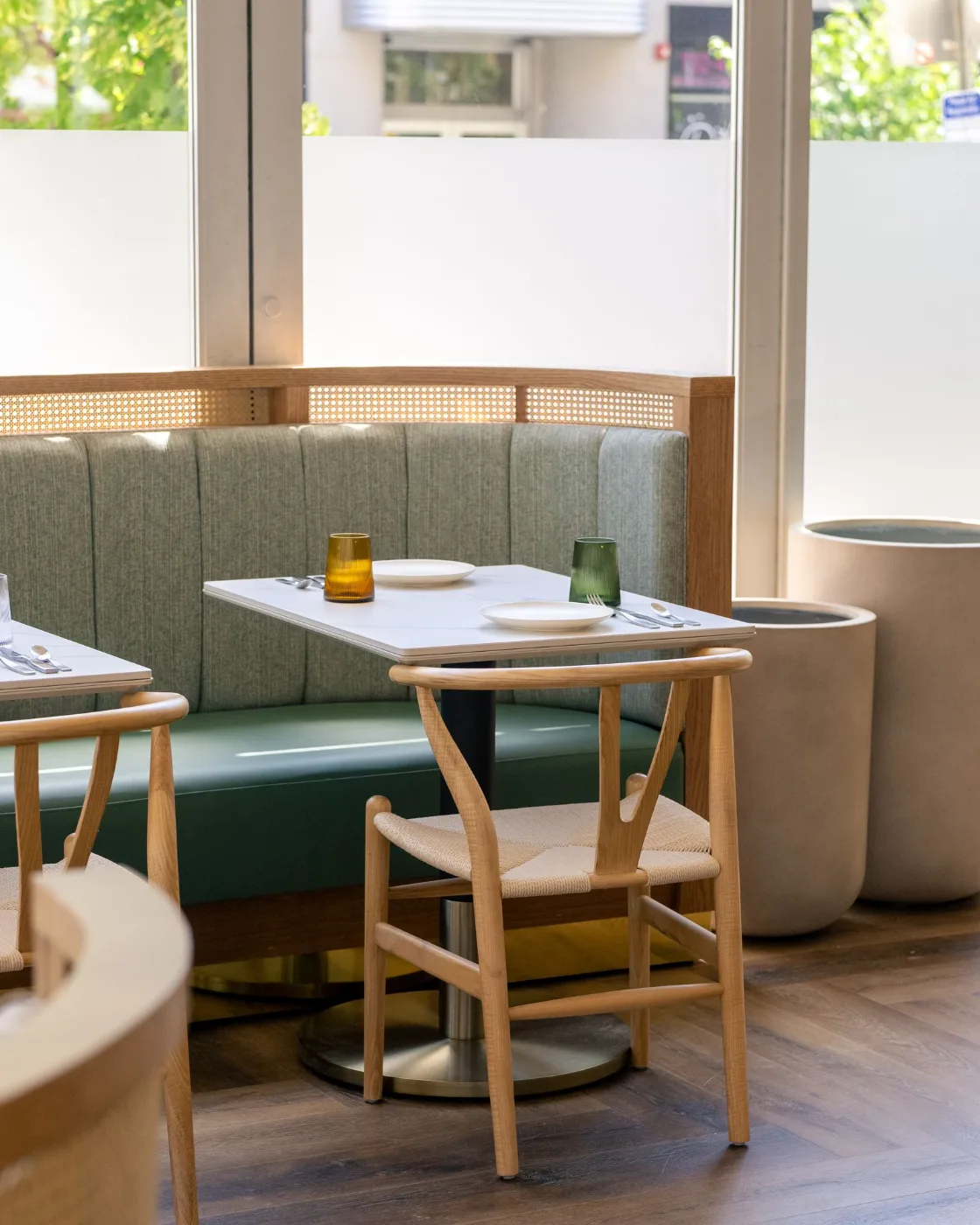 Semi-private banquette seating by the windows at Esquina No. 525