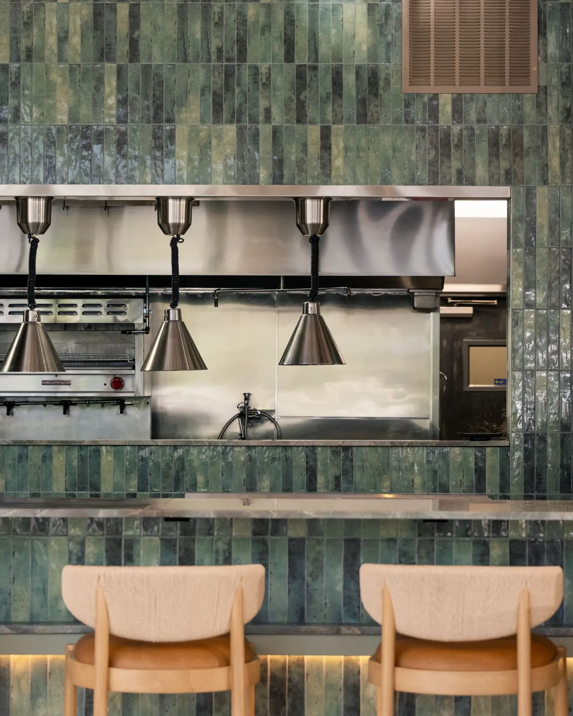 Chef’s counter seating at the kitchen pass for private dining at Esquina No. 525